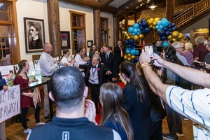 Buddy and Guest on Red Carpet at Night to Shine